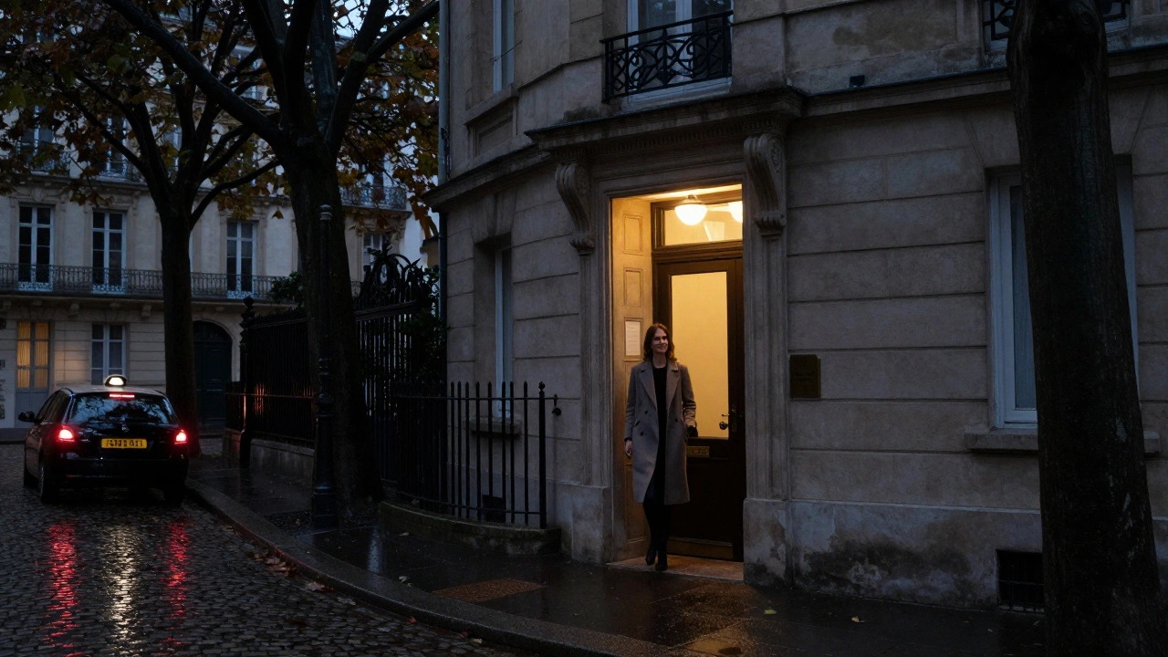 A woman entering a quiet townhouse in Paris at night, a taxi pulling away under tree-lined streets.