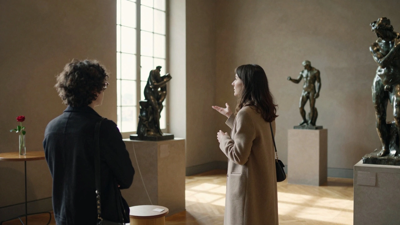 A woman guides a client through the empty Musée Rodin at sunrise, sunlight illuminating bronze sculptures.